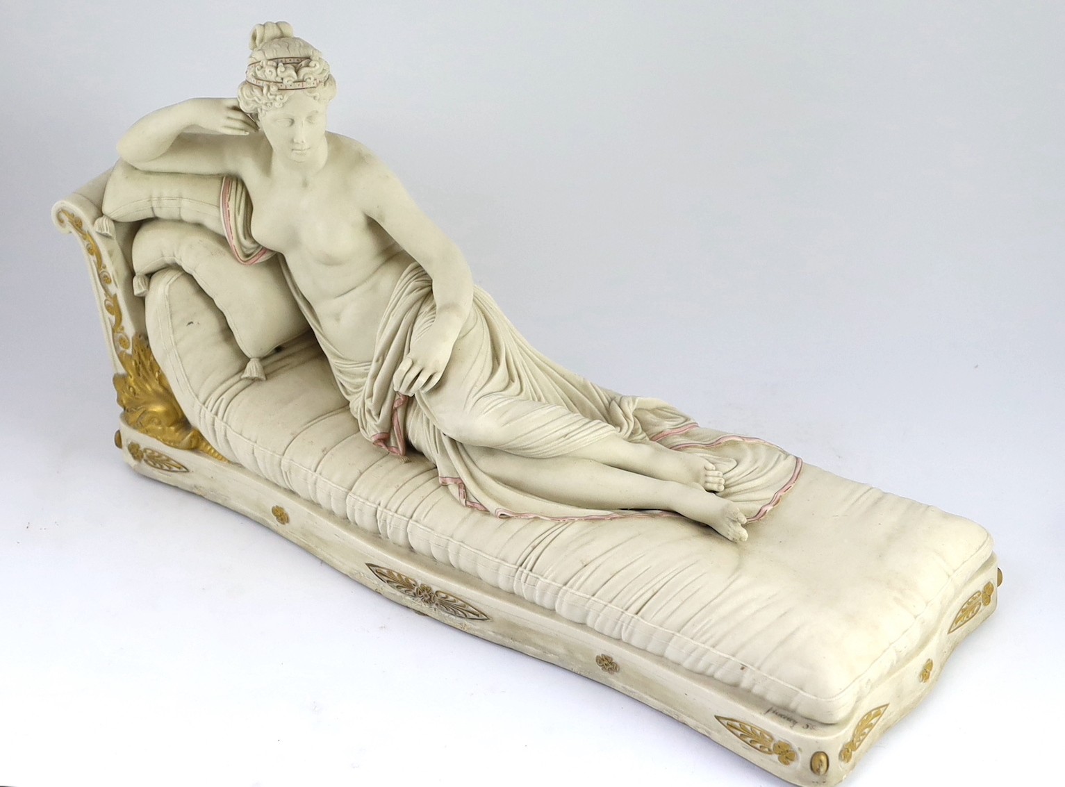 A Royal Worcester parian figure, after Antonio Canova, of Pauline Borghese as Venus Victorious, modelled by James Hadley, c.1866, 59.5cm long, some restoration to edge of base